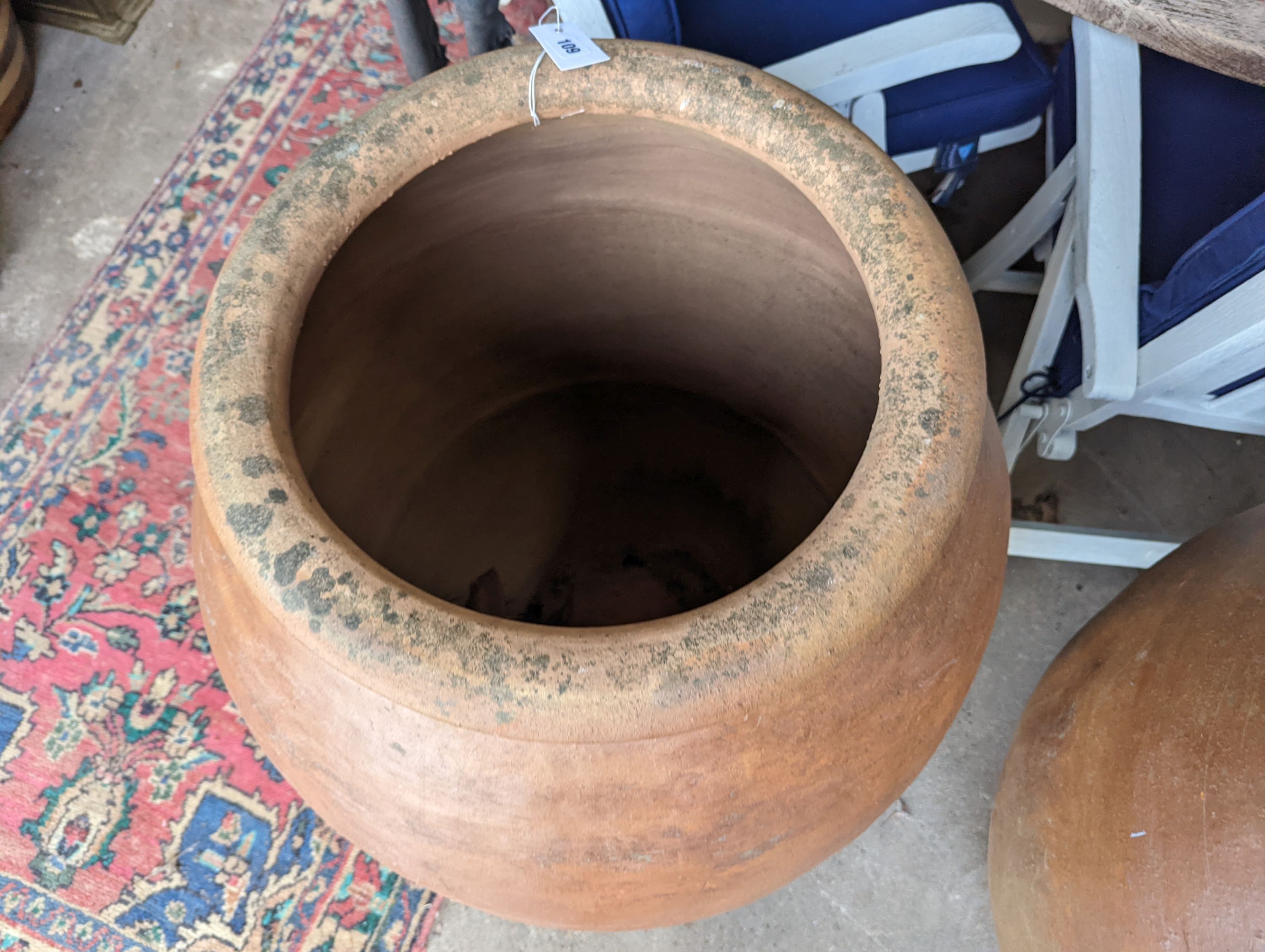 A pair of large terracotta garden planters, height 88cm